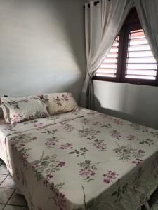 Ένα ή περισσότερα κρεβάτια σε δωμάτιο στο Quartos em Casa Familiar, Aeroclube, Praia do Bessa