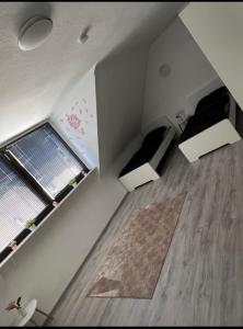 a small room with a bed and a window at Las Vegas by D&J Apartment‘s in Oberhausen
