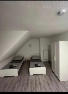 a room with two beds in a attic at Las Vegas by D&J Apartment‘s in Oberhausen