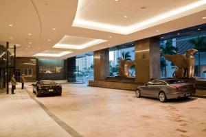 two cars parked in a lobby of a building at JW Marriott Marquis Miami in Miami