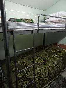a couple of bunk beds in a room at Teak house Chiang Mai in Chiang Mai