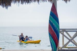 two people in a kayak in the ocean at Tintipan Hotel in Tintipan Island