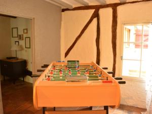 a plastic foosball table in a room at Gîte familial à Arrou avec jardin, babyfoot, mezzanine suspendue et cuisine équipée - FR-1-581-93 in Arrou