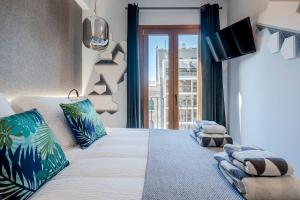 Voodi või voodid majutusasutuse Stay U-nique Apartments Rambla Catalunya III toas