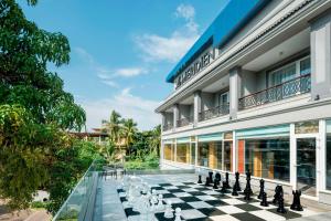 a chess board in front of a building at Le Meridien Goa, Calangute in Calangute