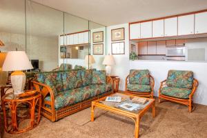 a living room with a couch and two chairs and a table at Sugar Beach 223 - MCH in Kihei