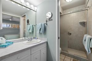 a bathroom with a sink and a shower at Sugar Beach 306 - MCH in Kihei