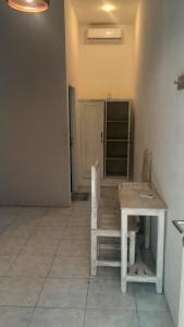a room with a wooden table and a bench at Wombat's B&B in Gili Trawangan +50 photos