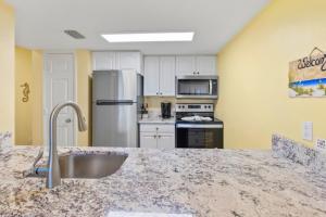 a kitchen with a sink and a counter top at South Seas Beach Villa 2412 condo in Captiva