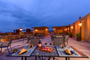 a patio with a table with food on it at Krystal Grand Residences & Villas San Miguel de Allende in San Miguel de Allende