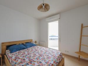 a bedroom with a bed and a large window at Appartement Calme avec Grande Terrasse, Aytré, Proche Lac, 2 Pers. - FR-1-535-49 in Aytré