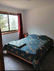 Ένα ή περισσότερα κρεβάτια σε δωμάτιο στο Cabañas rústicas Pichilemu