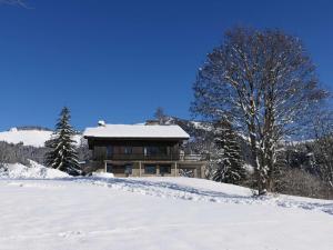 a house on a hill with snow on it at Chalet Notre-Dame-de-Bellecombe, 8 pièces, 14 personnes - FR-1-595-93 in Notre-Dame-de-Bellecombe