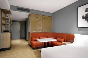 a room with a bed and a table and a couch at GRAVITY JOSUN Seoul Pangyo, Autograph Collection in Seongnam +54 photos