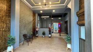 a lobby with a gas station in the background at The Loft Living Space in Samut Prakan