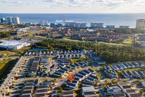 an aerial view of a city with buildings and the ocean at PALM COVE VACATION HOME- One level, Community pool, Pet Friendly in Panama City Beach