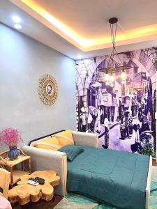 a room with a bed and a painting on the wall at Duplex WARM HANOI, 2 bedrooms, Old Quarter, 3mins to Hoan Kiem Lake in Hanoi