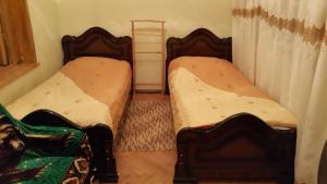 Postel nebo postele na pokoji v ubytování Guest House Wine