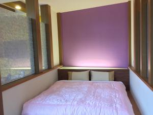 Postel nebo postele na pokoji v ubytování Nantou Xitou Riverside Homestay B&B