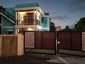 a house with a gate in front of it at Villa Turquoise in Calodyne +8 photos