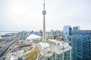 an aerial view of a city with a tall tower at Downtown Toronto Gem in Toronto