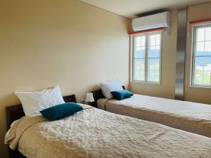 מיטה או מיטות בחדר ב-La Krasse Angelroad WEST