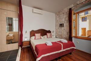 Voodi või voodid majutusasutuse Heritage Hotel Tragos toas