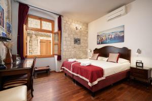 Voodi või voodid majutusasutuse Heritage Hotel Tragos toas