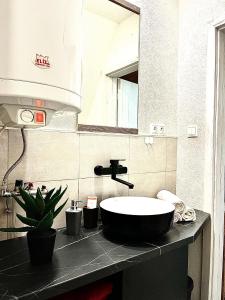 a bathroom with a sink and a mirror at Chata na Liptove in Liptovská Porúbka
