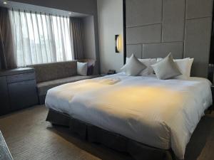 Letto o letti in una camera di Hotel Trusty Nagoya Shirakawa