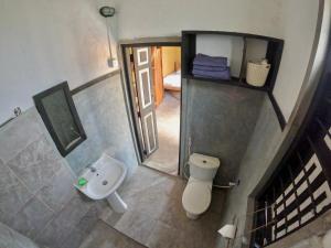 an overhead view of a bathroom with a toilet and a sink at The Loft by the Lake in Kurunegala