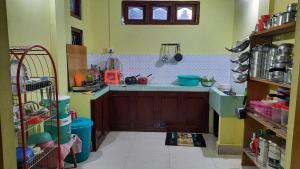 a kitchen with a sink and a counter top at Anna homestay in Dirang Dzong