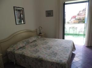 Postel nebo postele na pokoji v ubytování La Tavolozza Residence