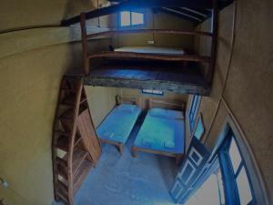 an overhead view of a room with two bunk beds at The Loft by the Lake in Kurunegala +39 photos