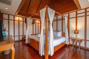 Postel nebo postele na pokoji v ubytování Orchidacea Resort - Kata Beach + 37 fotografií