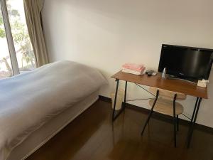 Lilac Hotels and Resort tesisinde bir odada yatak veya yataklar