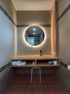 a bathroom with a sink and a mirror at Lakeforest B&B in Yuanshan