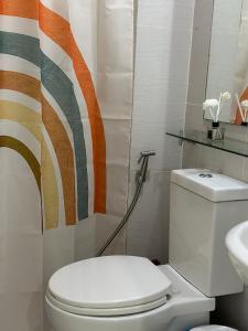 a bathroom with a toilet and a sink at S&N Azure Staycation in Manila