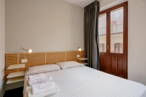 Postel nebo postele na pokoji v ubytování Il Palazz8