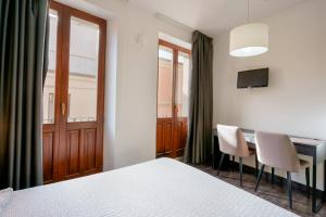 Postel nebo postele na pokoji v ubytování Il Palazz8