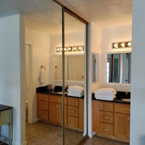 a bathroom with a glass shower and a sink at Spacious Pleasanton Home, 4br-2ba, Kitchen, WiFi, Laundry, Parking and More in Pleasanton