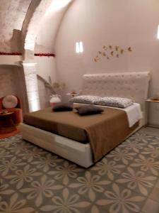 Postel nebo postele na pokoji v ubytování Nenetta Rooms & Suites Monopoli