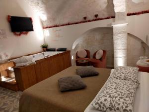 TV a/nebo společenská místnost v ubytování Nenetta Rooms & Suites Monopoli