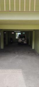 un coche aparcado dentro de un garaje en HOTEL NL7, en Dimāpur