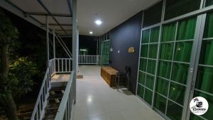 a hallway of a building with a staircase and windows at RIVERVIEW HOMESTAY PERLIS in Kangar