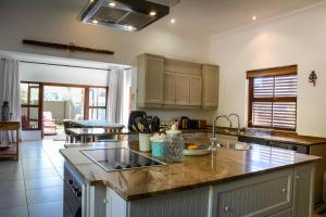 a kitchen with a sink and a counter top at Farmhouse chic in Parys