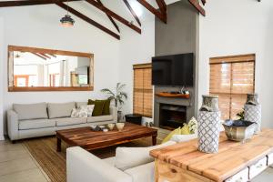 a living room with a couch and a table at Farmhouse chic in Parys