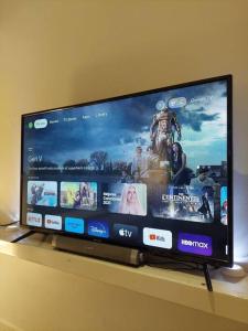 a flat screen tv sitting on top of a shelf at Perfect and modern Studio, Broadway-Chippendale in Sydney