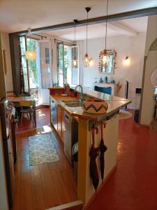 a kitchen with a large island in the middle at La Vie de Bohème Avignon in Avignon