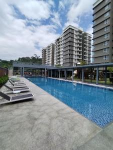 a large swimming pool on top of a building at Double Nine Homestay - Sri Indah Condominium in Sandakan